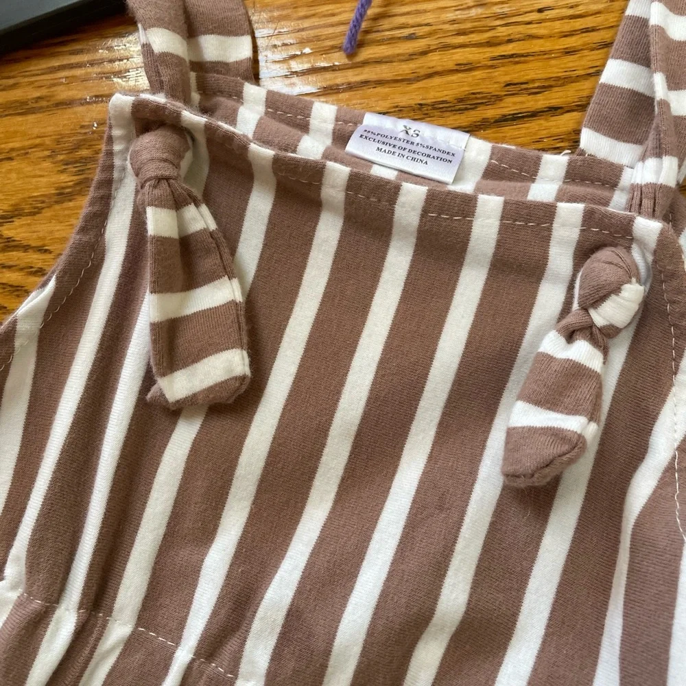 Girls striped toddler’s overalls with floral top.  Size XS (2T). No brand.
